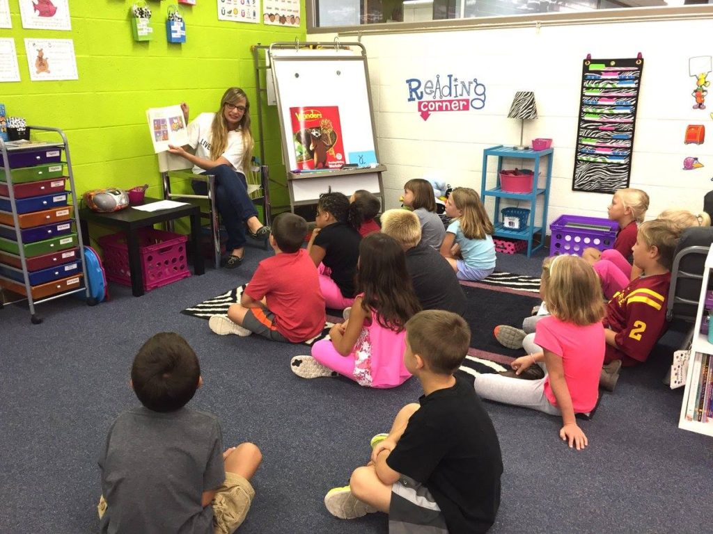 Taylor reading with Third Graders at Story City Elementary School.